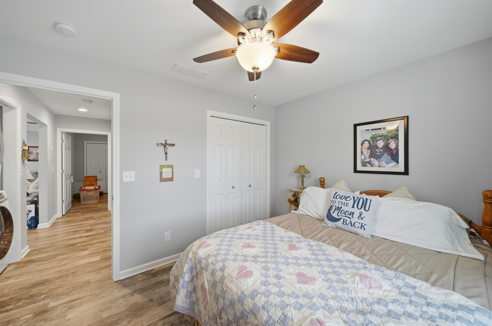 1525 Eadens Place Dixon, IL 61021 - Photo 28 of 30 a bedroom with a large bed and a chandelier