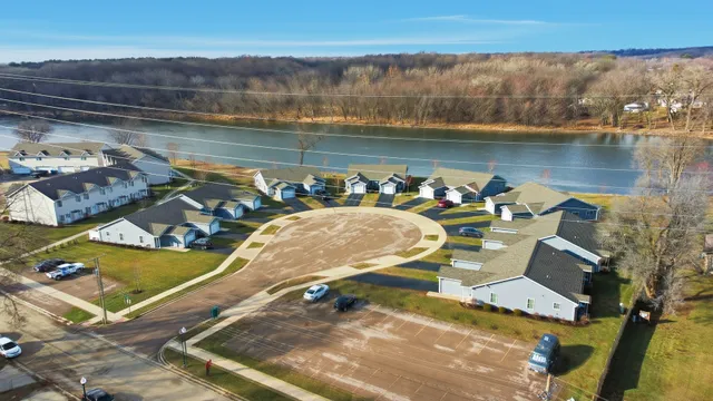 an aerial view of a house with a lake view