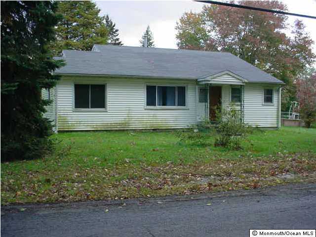 29 Merrick Road Farmingdale, NJ 07727 - Photo 1 of 1 a view of front of a house with a yard