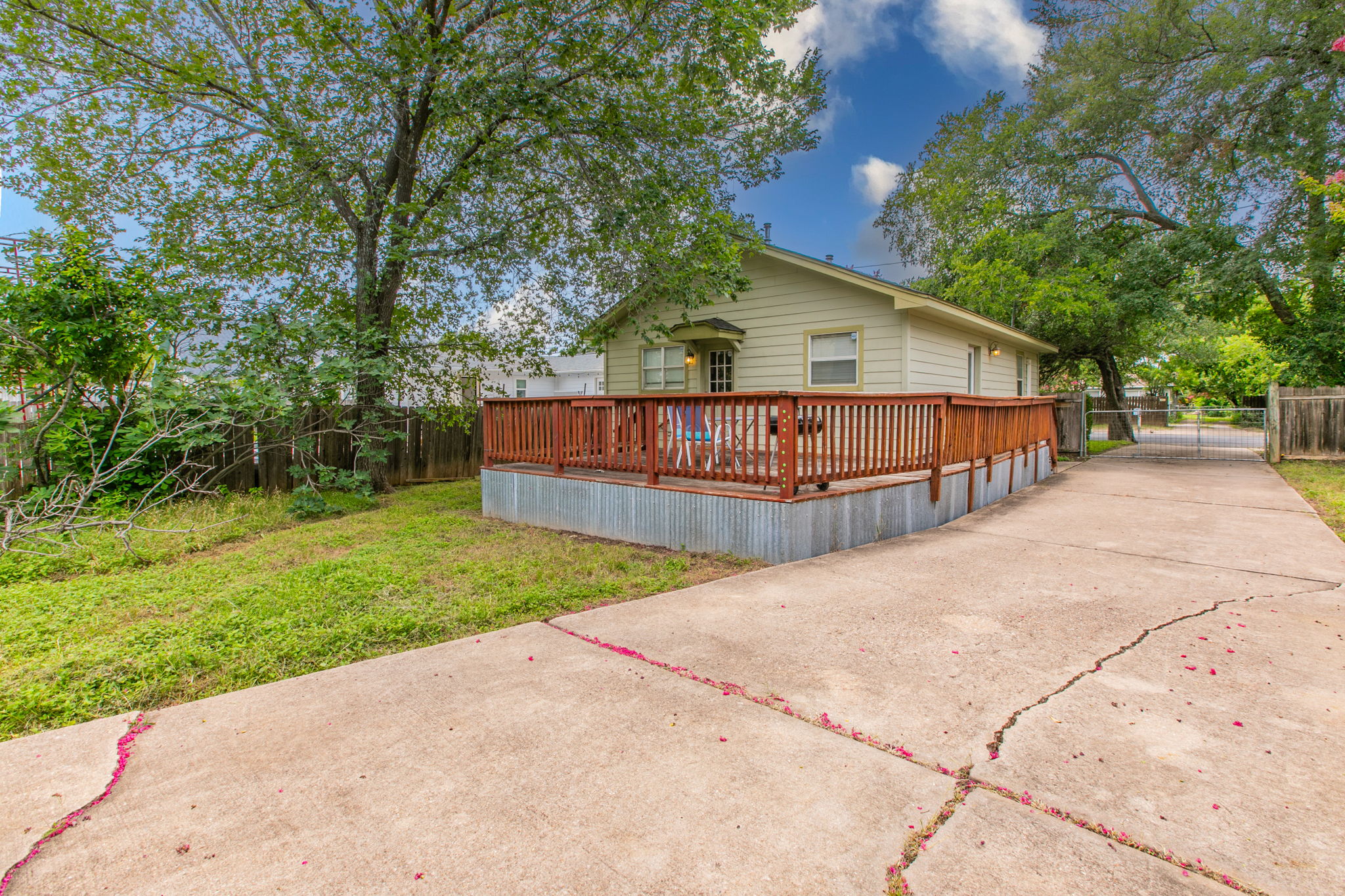 1107 Vargas Road Austin, TX 78741 - Photo 15 of 17 A welcoming wooden deck extends from this charming residence, ideal for outdoor enjoyment.