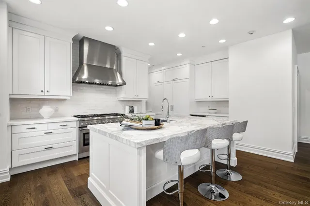 a kitchen with a stove a sink and a refrigerator