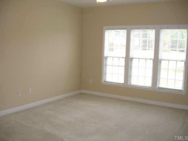 4100 Gallatree Lane Raleigh, NC 27616 - Photo 4 of 10 Large Master Suite includes his and hers walk-in closets, double vanity, jetted tub, and seperate shower--very light and bright