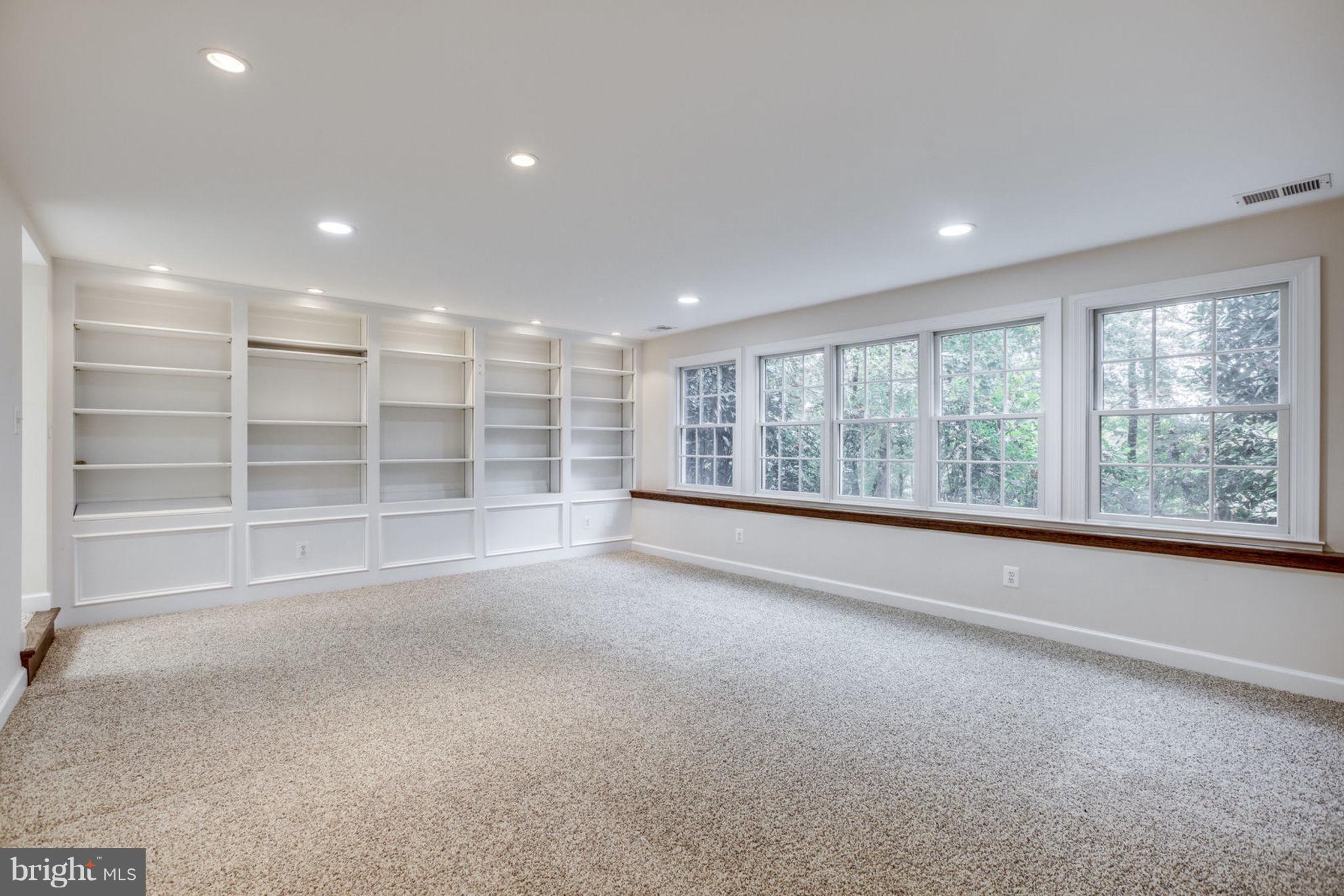 8734 Center Road Springfield, VA 22152 - Photo 33 of 40 Large, bright Bonus Room with Custom Bookcases