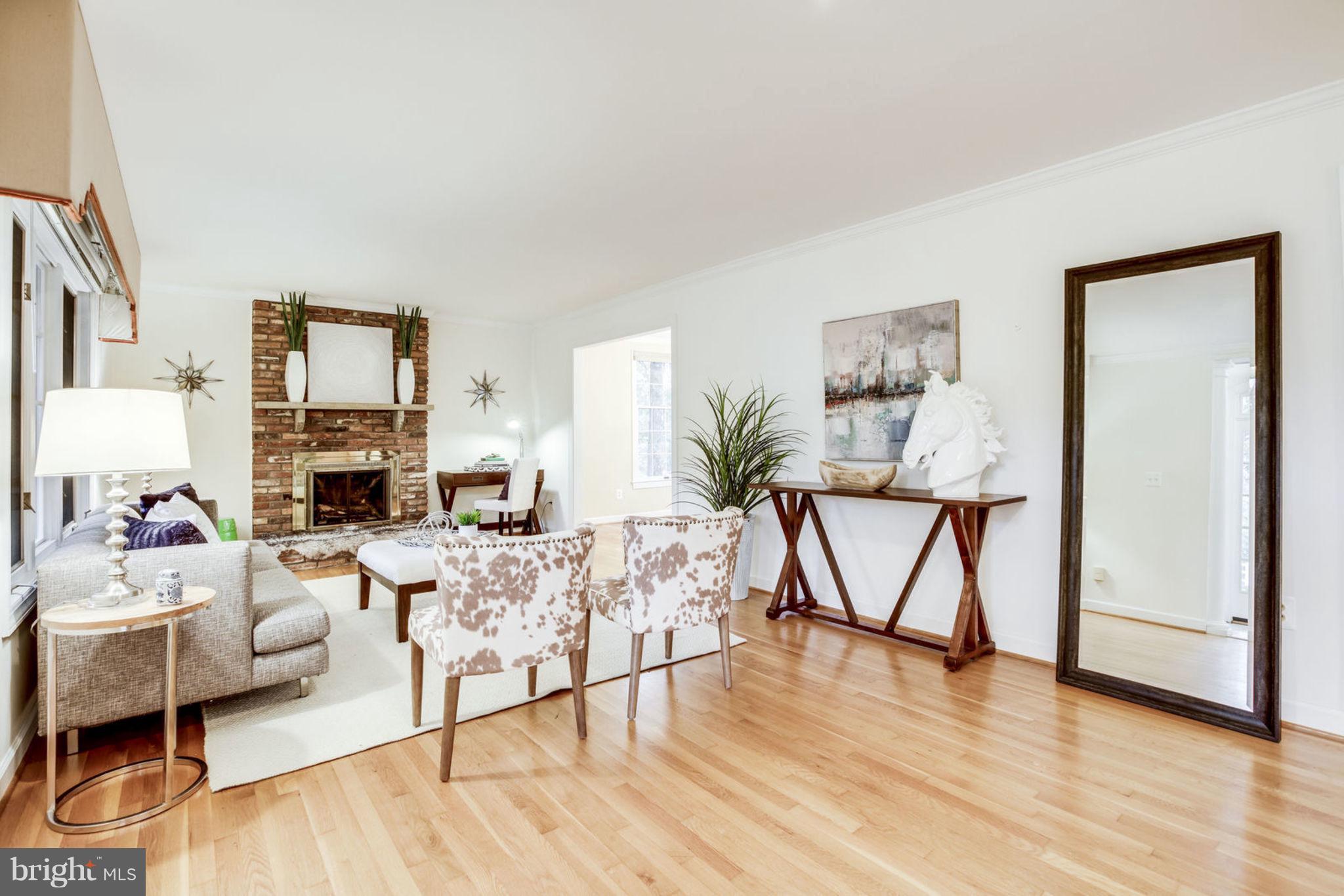8734 Center Road Springfield, VA 22152 - Photo 6 of 40 Living Room w/ Cozy Fireplace & bright Hardwoods
