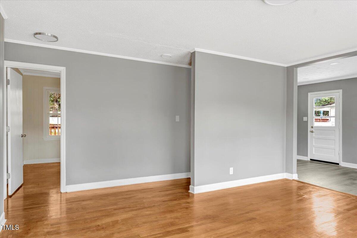 712 East 13th Street Roanoke Rapids, NC 27870 - Photo 14 of 46 a view of an empty room with wooden floor and closet