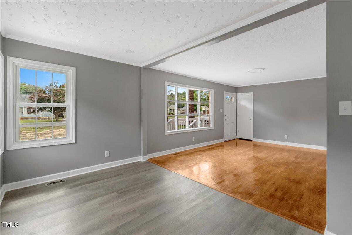 712 East 13th Street Roanoke Rapids, NC 27870 - Photo 16 of 46 an empty room with windows