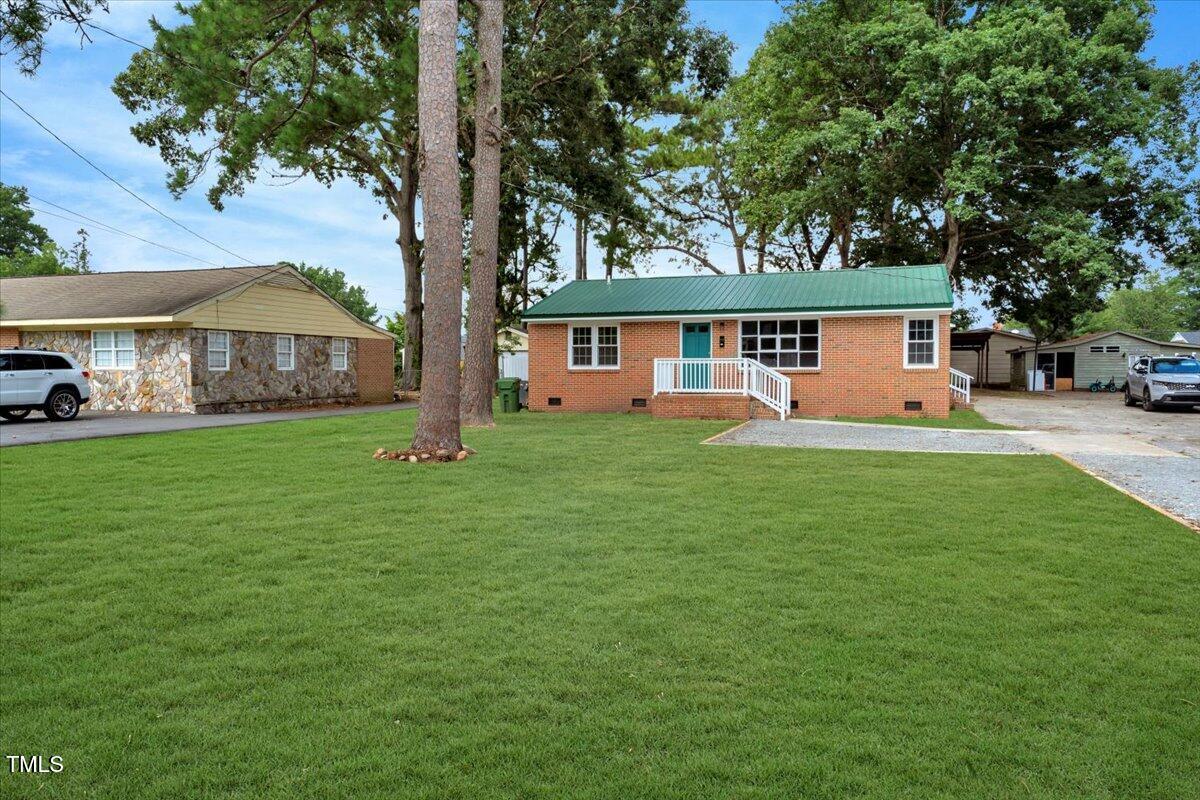712 East 13th Street Roanoke Rapids, NC 27870 - Photo 21 of 46 a front view of house with yard and green space