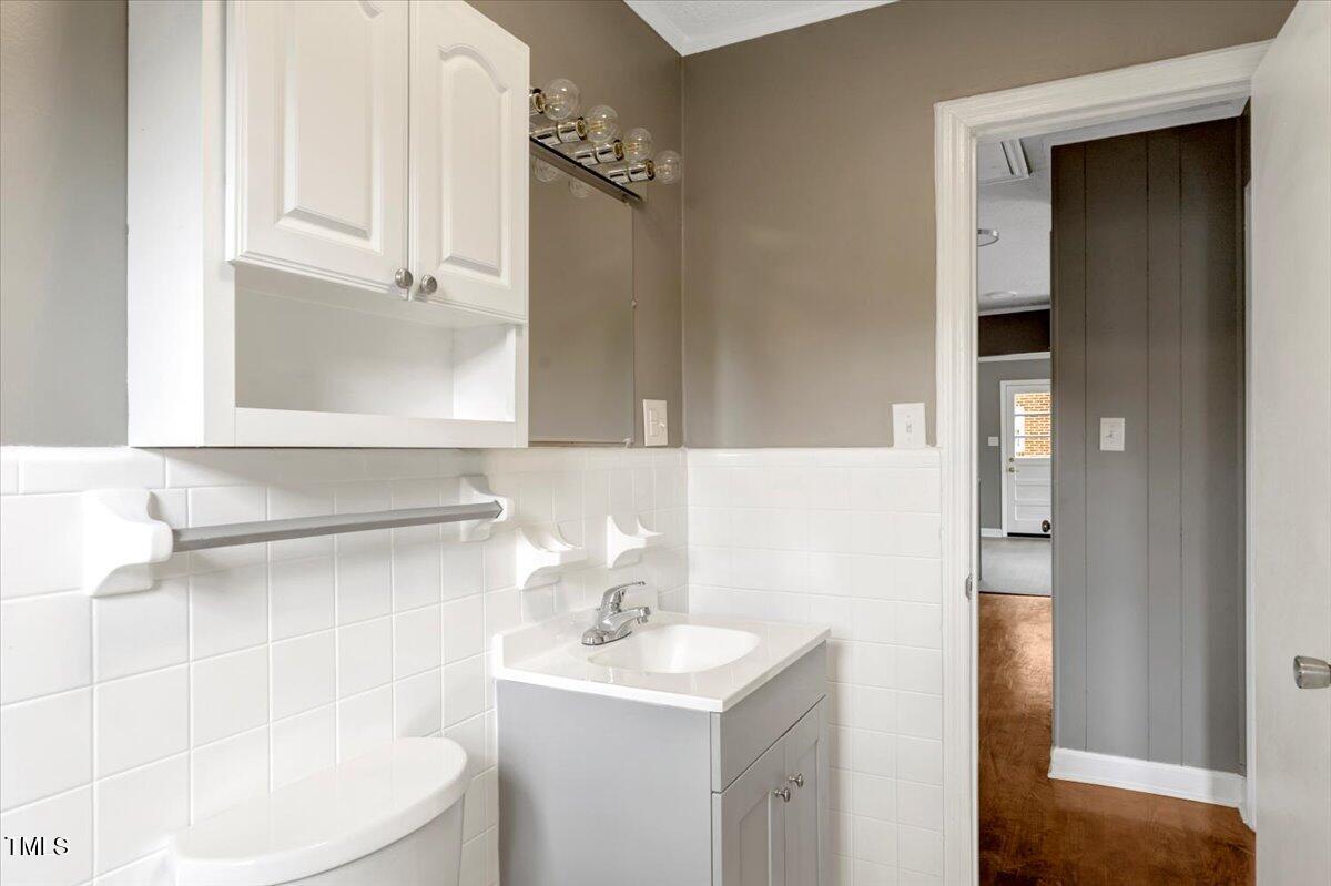 712 East 13th Street Roanoke Rapids, NC 27870 - Photo 25 of 46 a bathroom with a sink a toilet and shower