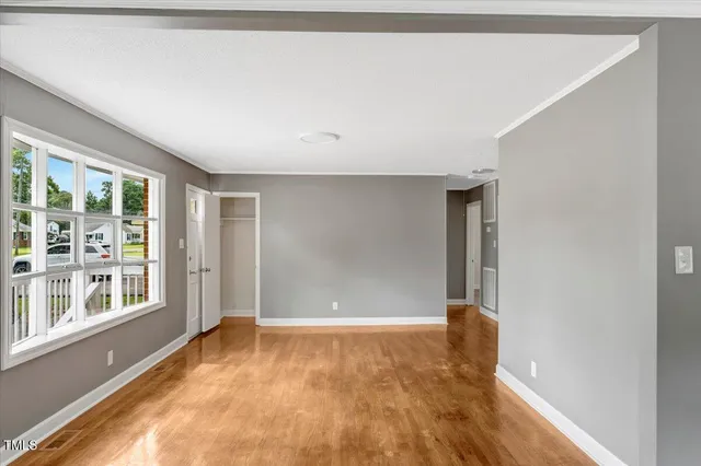 a view of an empty room with a window