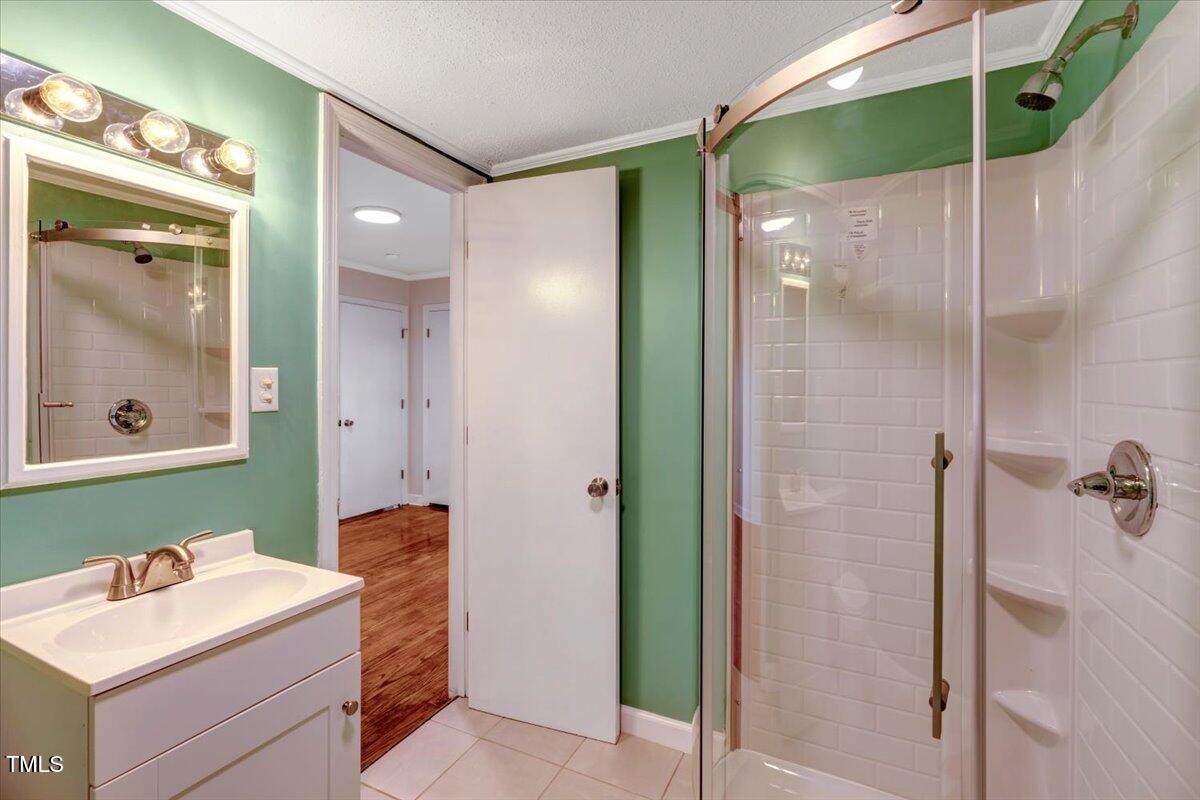 712 East 13th Street Roanoke Rapids, NC 27870 - Photo 35 of 46 a bathroom with a sink and a mirror