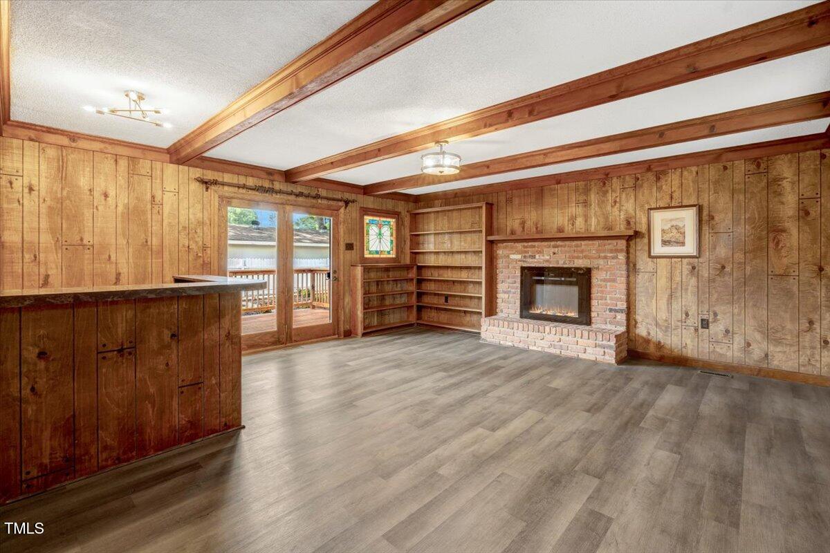 712 East 13th Street Roanoke Rapids, NC 27870 - Photo 39 of 46 a view of an empty room with a fireplace and a window