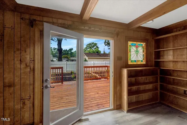 a view of walk in closet and bedroom