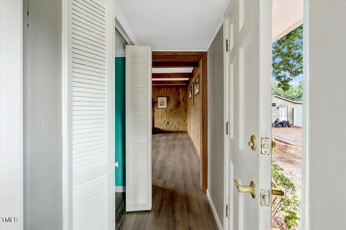 712 East 13th Street Roanoke Rapids, NC 27870 - Photo 43 of 46 a view of a hallway with wooden floor and staircase