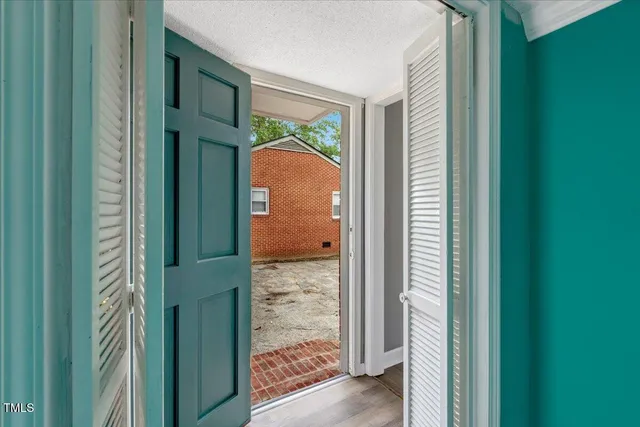 a view of a bedroom from a hallway