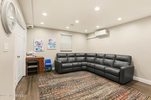 a living room with furniture and a rug