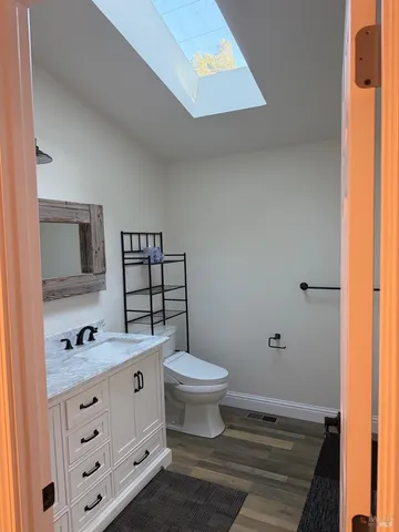 a bathroom with a toilet and a sink