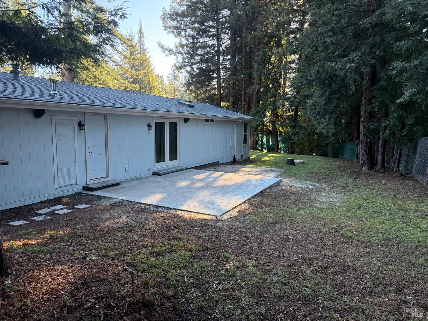 38350 Old Stage Road Gualala, CA 95445 - Photo 17 of 23 a view of a house with a yard and garage