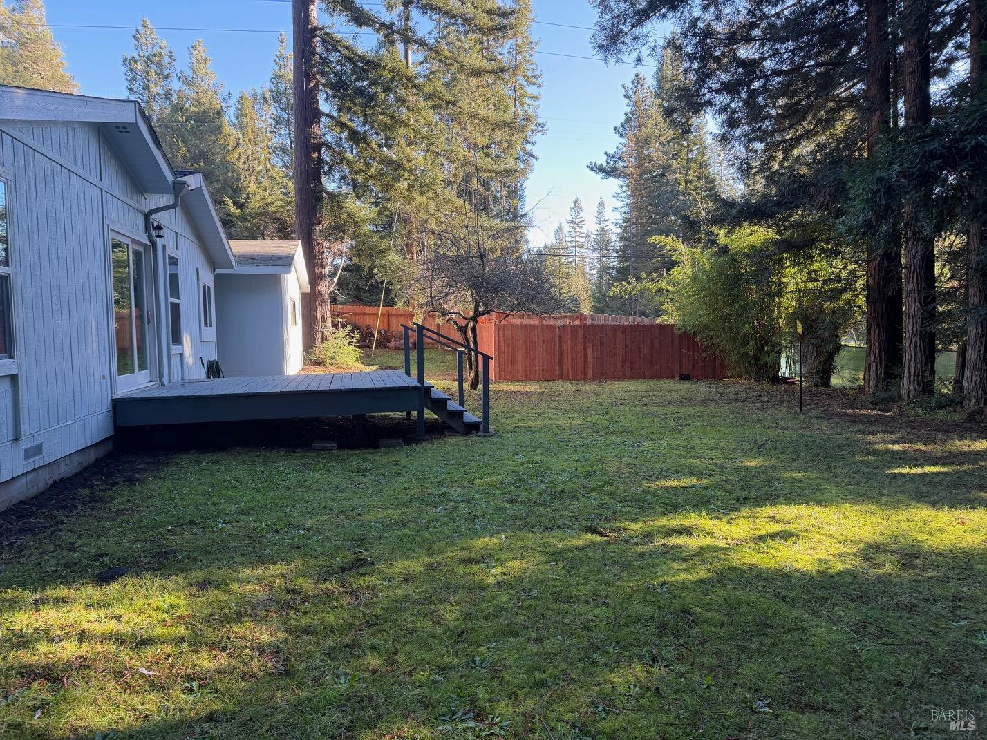 38350 Old Stage Road Gualala, CA 95445 - Photo 19 of 23 a view of a backyard with large trees