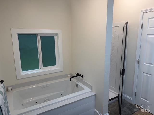 38350 Old Stage Road Gualala, CA 95445 - Photo 8 of 23 a bathroom with a tub and a window