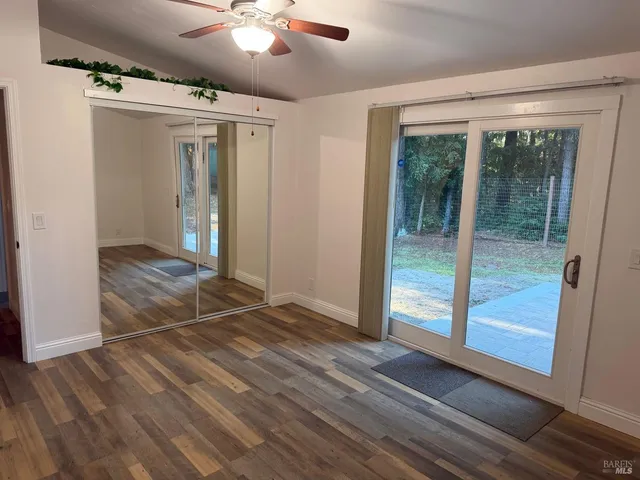 a view of entryway with wooden floor