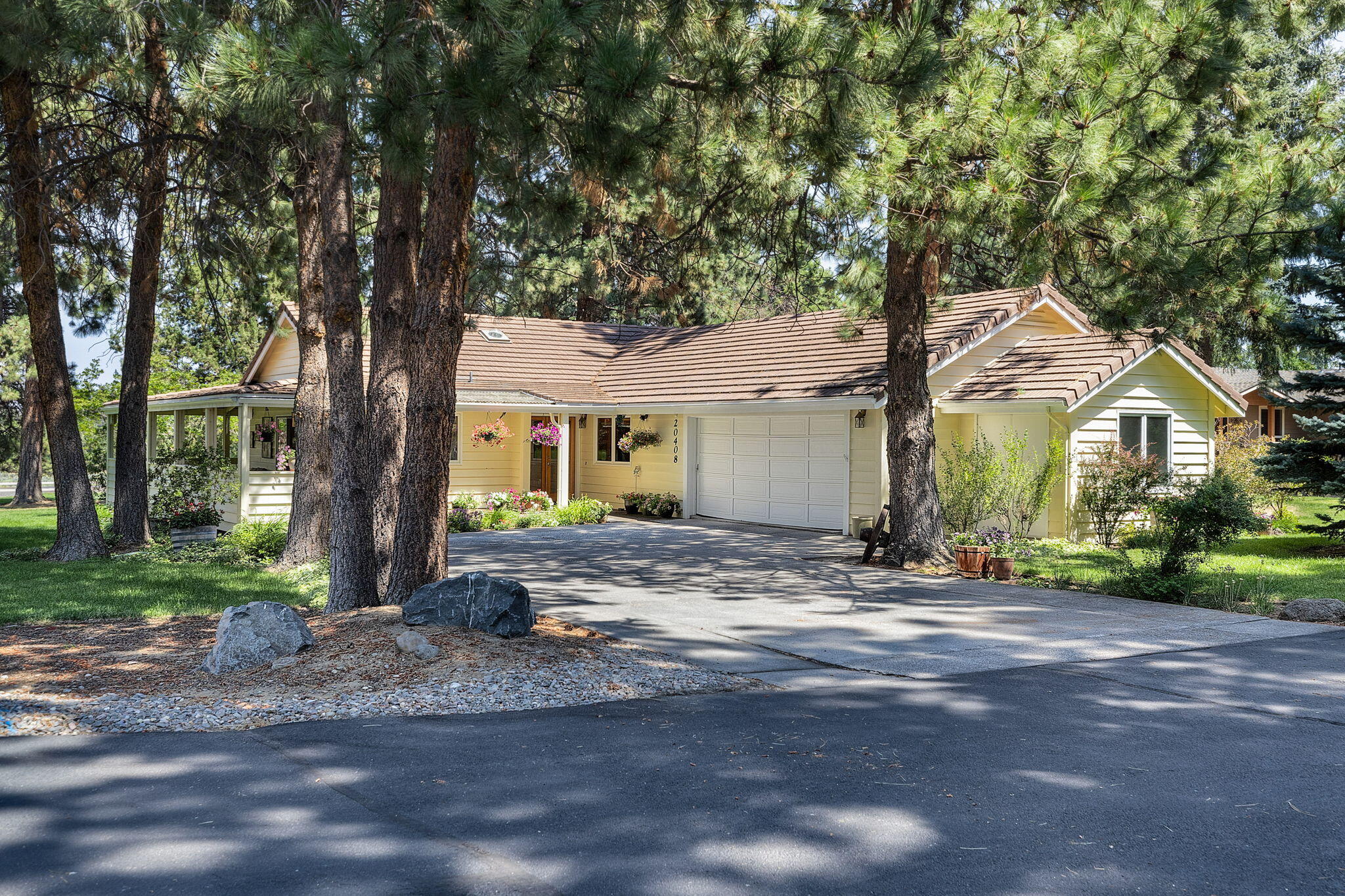 20408 Butt Riggin Road Bend, OR 97702 - Photo 22 of 36 a front view of a house with garden