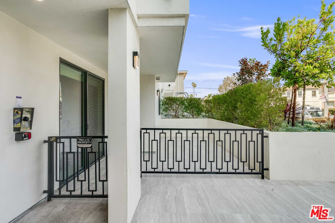 1021 South Shenandoah Street, Unit 101 Los Angeles, CA 90035 - Photo 17 of 18 a view of a balcony with wooden floor