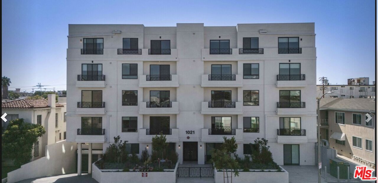 1021 South Shenandoah Street, Unit 101 Los Angeles, CA 90035 - Photo 18 of 18 a large building with a lot of windows