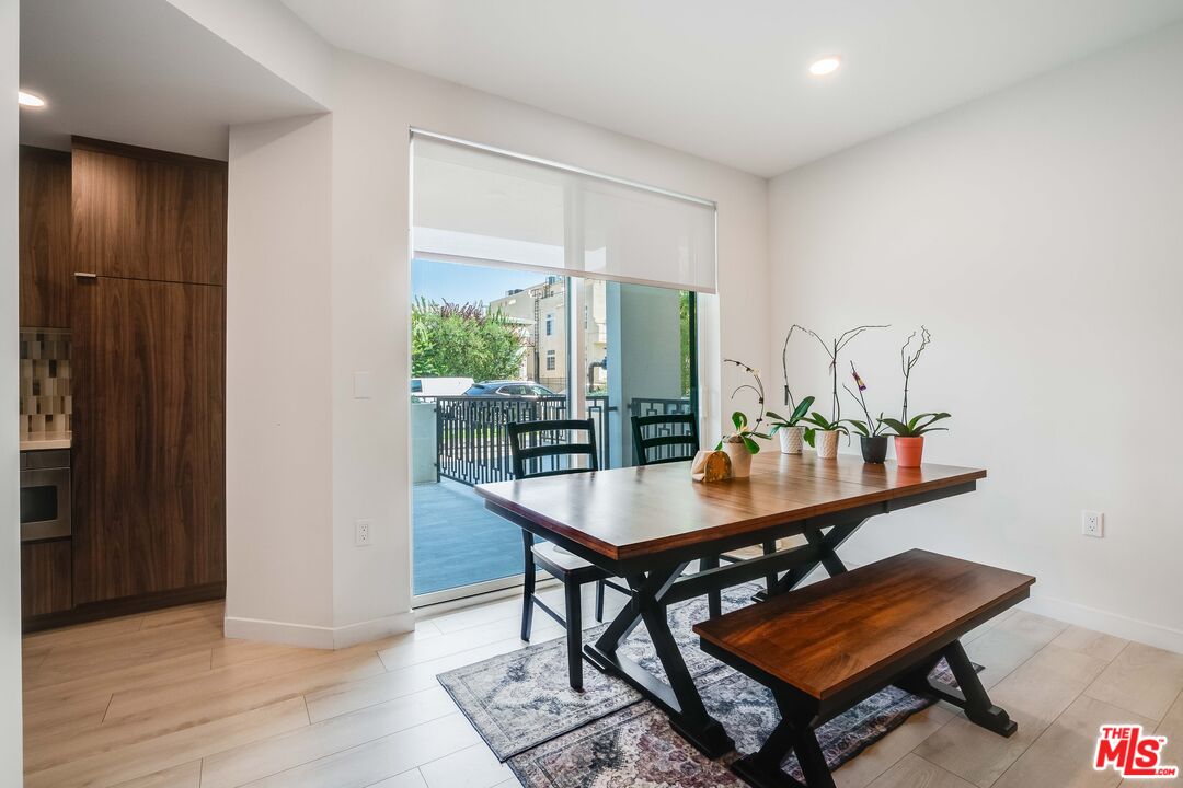 1021 South Shenandoah Street, Unit 101 Los Angeles, CA 90035 - Photo 4 of 18 a room with furniture and wooden floor