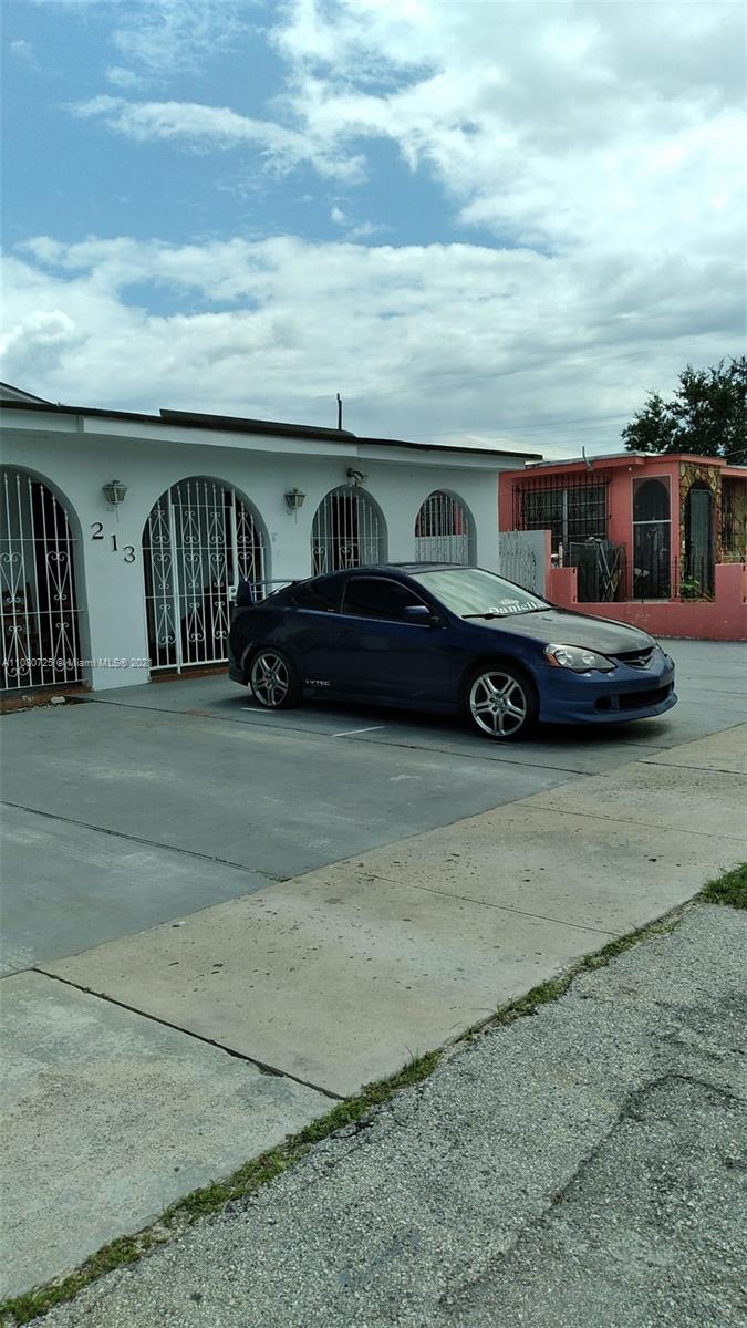 a view of a car in front of a building