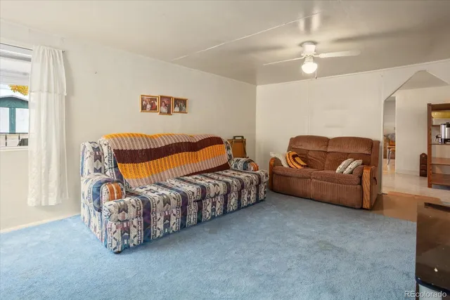 a bedroom with furniture and a chandelier