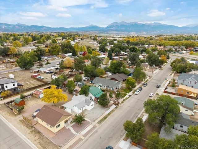 an aerial view of residential houses with outdoor space