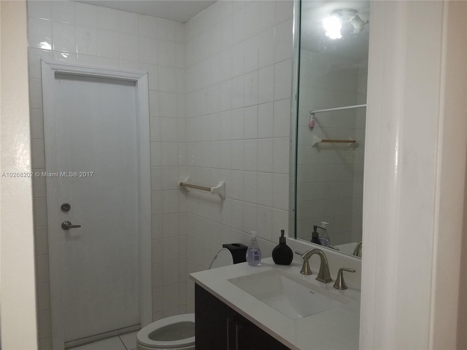 3091 Southwest 84th Court Miami, FL 33155 - Photo 12 of 24 a bathroom with a sink toilet and vanity