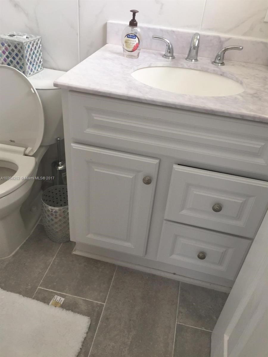 3091 Southwest 84th Court Miami, FL 33155 - Photo 14 of 24 a bathroom with a sink and toilet