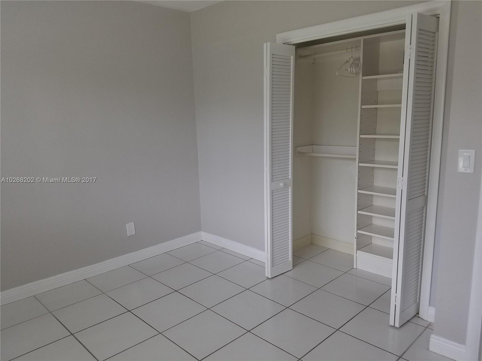 3091 Southwest 84th Court Miami, FL 33155 - Photo 17 of 24 a view of an empty walk in closet