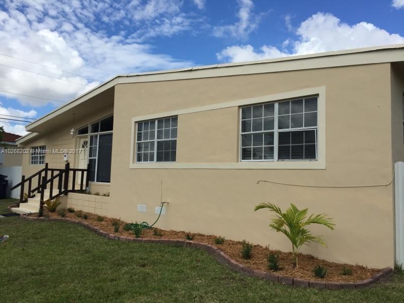 3091 Southwest 84th Court Miami, FL 33155 - Photo 3 of 24 a house with a garden in front of it