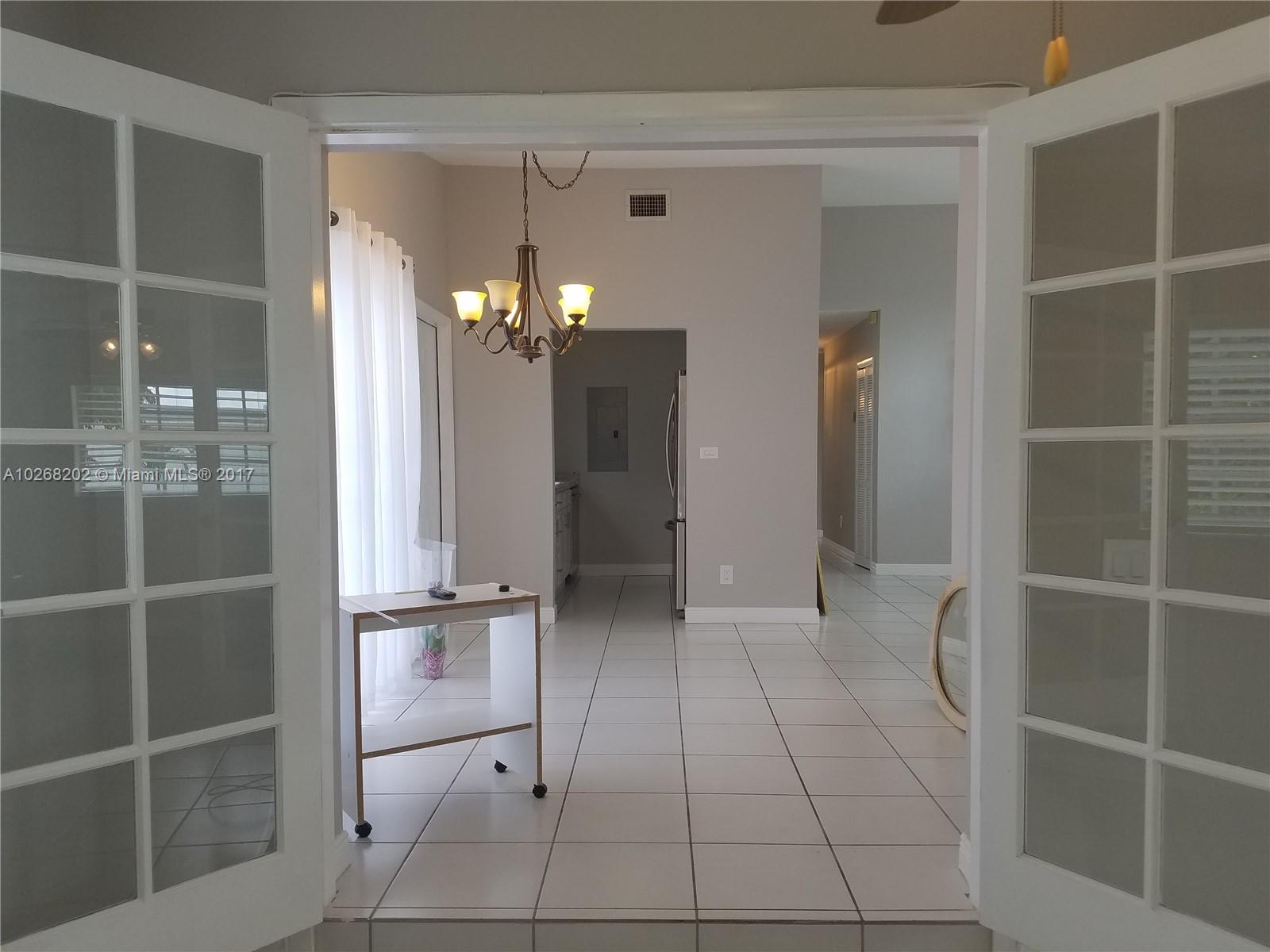 3091 Southwest 84th Court Miami, FL 33155 - Photo 6 of 24 a view of a closet area with entryway