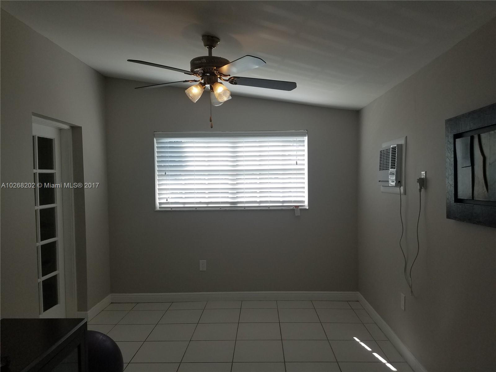 3091 Southwest 84th Court Miami, FL 33155 - Photo 9 of 24 a view of an empty room with a window