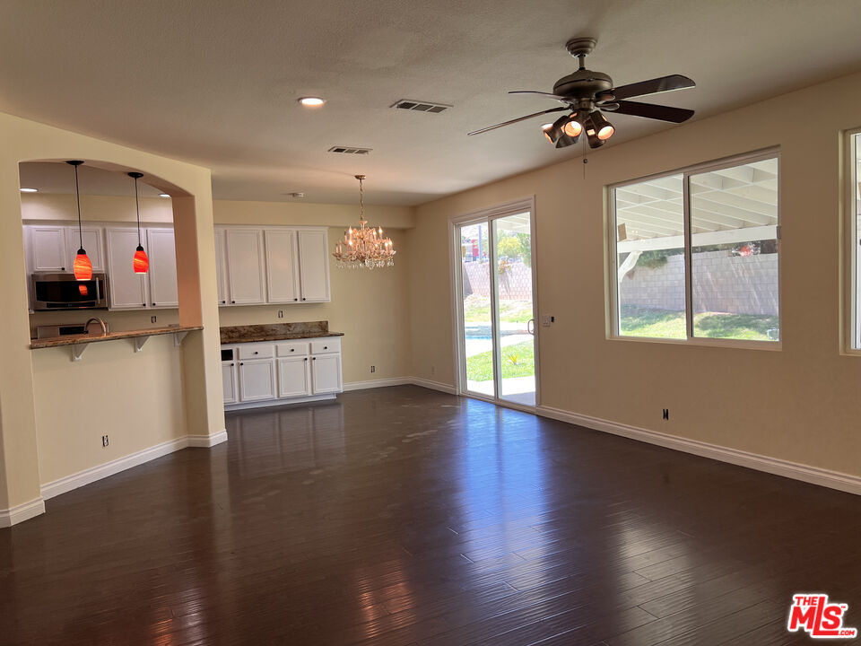 40247 Preston Road Palmdale, CA 93551 - Photo 5 of 15 wooden floor in an empty room with a window