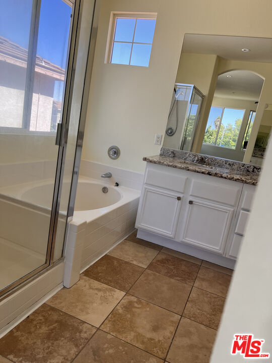 40247 Preston Road Palmdale, CA 93551 - Photo 9 of 15 a bathroom with a tub sink and mirror