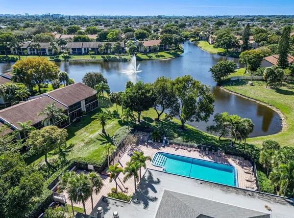 an aerial view of a house with a lake view