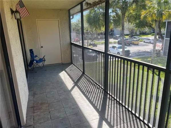 a view of balcony with furniture