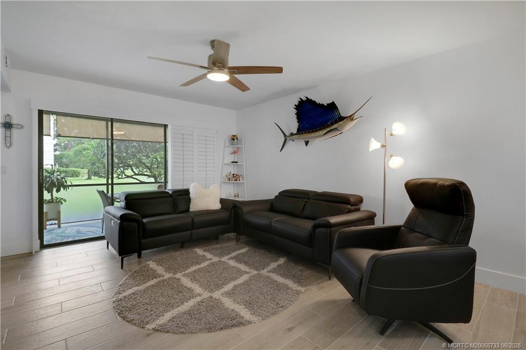 1001 Keystone Drive, Unit A Jupiter, FL 33458 - Photo 13 of 30 a living room with furniture and a large window