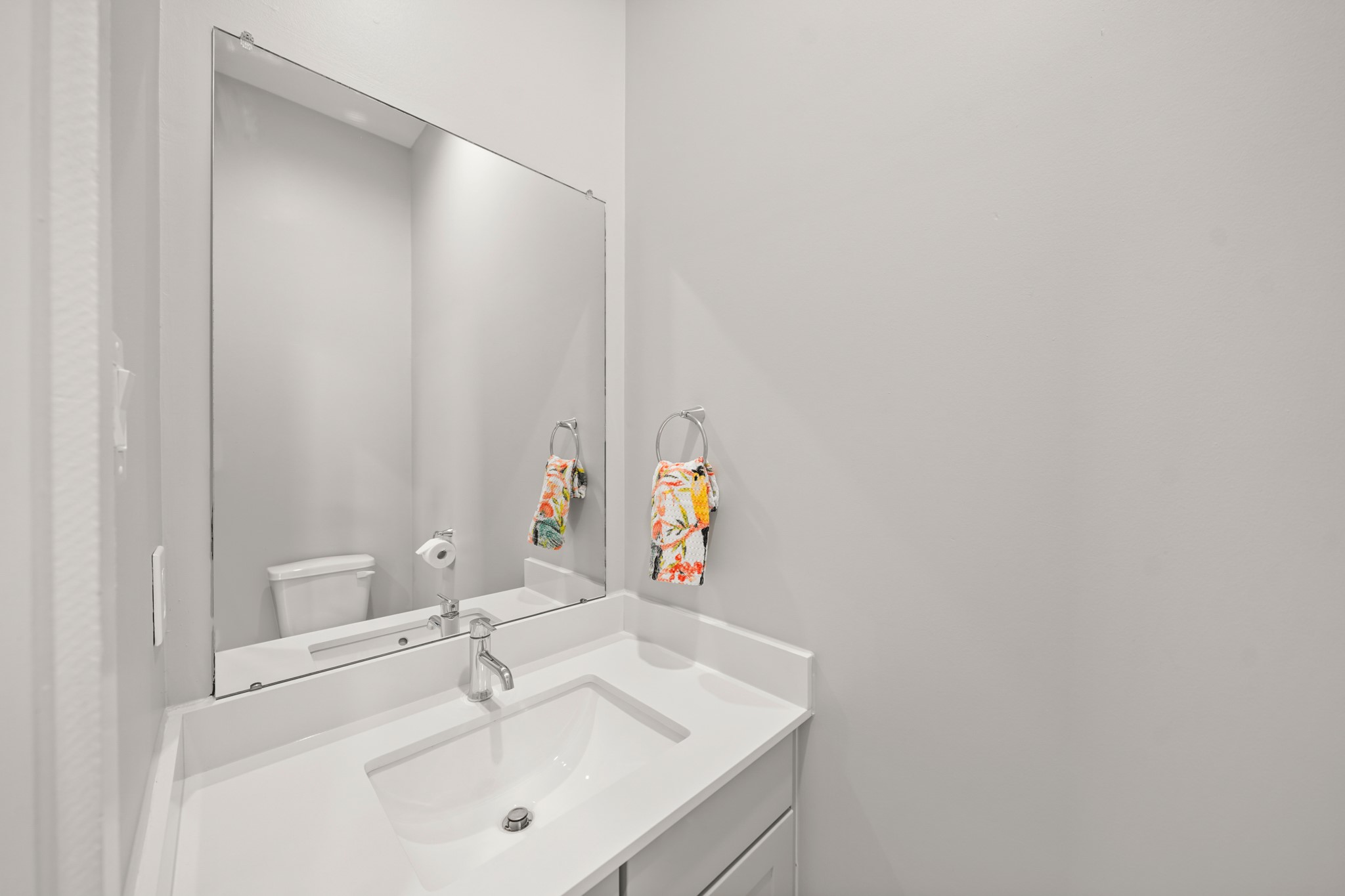 720 West Donovan Street Houston, TX 77091 - Photo 17 of 42 Tucked away on the second level of the home and convenient for guests is a half bath with a painted Shaker-style cabinet, quartz counter top with integrated back splash and under-mount sink, wall mounted mirror, recessed lighting & hexagonal tile floors.