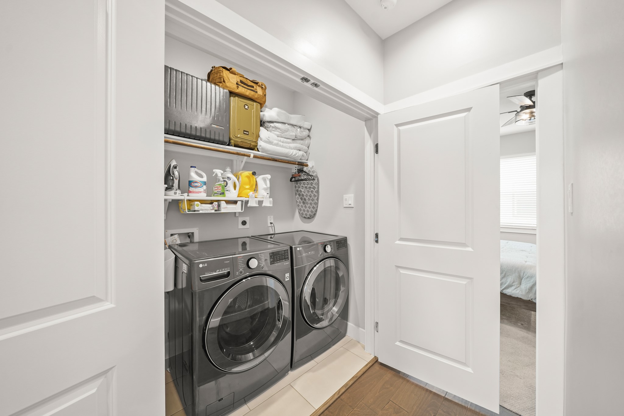 720 West Donovan Street Houston, TX 77091 - Photo 20 of 42 Tucked away behind a double door entry, the utility room has upper shelf & hanging wardrobe storage along with an LG full size washer & dryer which stays with the home. Gas and Electric Dryer connections are available.