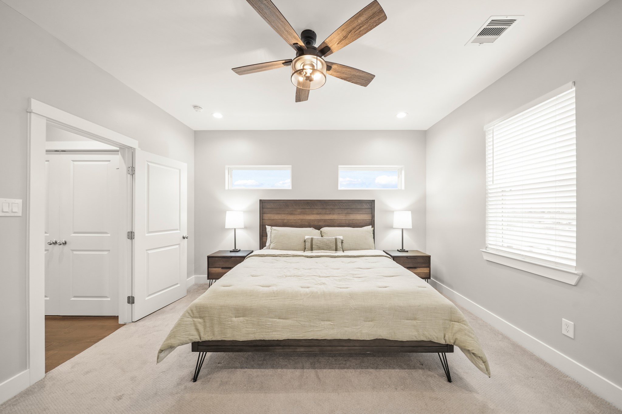 720 West Donovan Street Houston, TX 77091 - Photo 21 of 42 The owner's suite surrounded by windows with blinds allows plenty of natural light into the room. Carpet, recessed lights and a ceiling fan with light fixture completes the room.