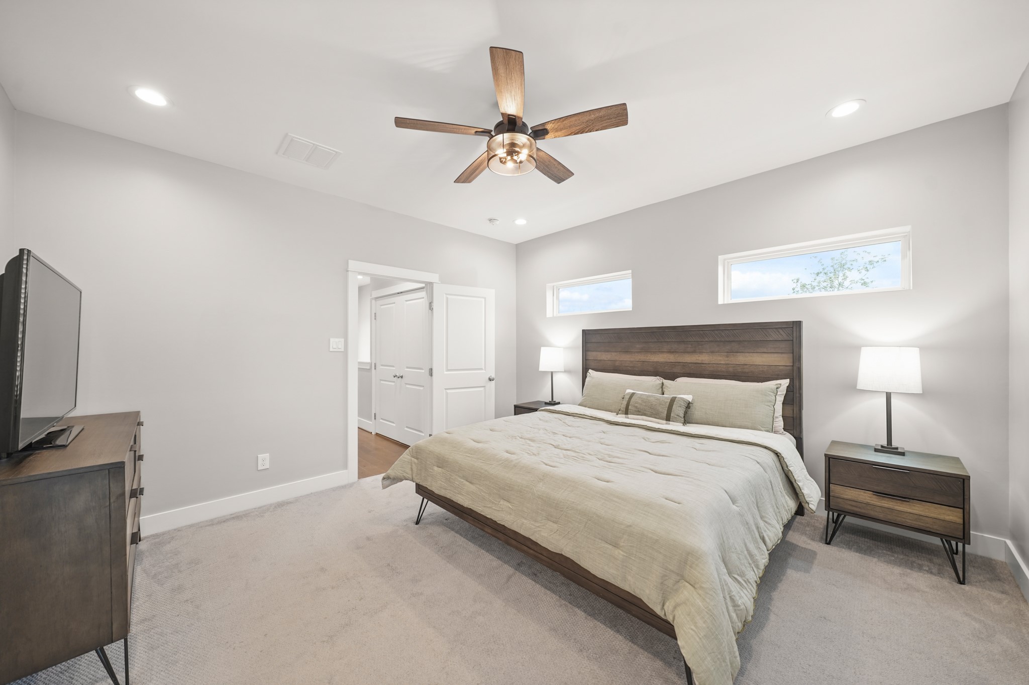 720 West Donovan Street Houston, TX 77091 - Photo 23 of 42 Another view offers a glimpse into the home’s practical layout offering access to the laundry room just outside the bedroom.