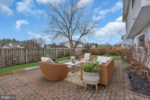 a view of a backyard with garden and plants