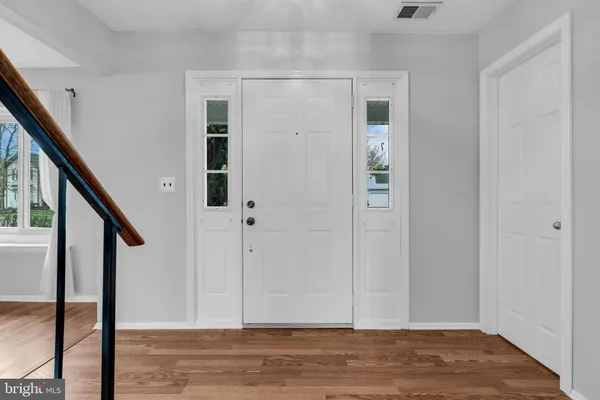 a view of entryway with wooden floor
