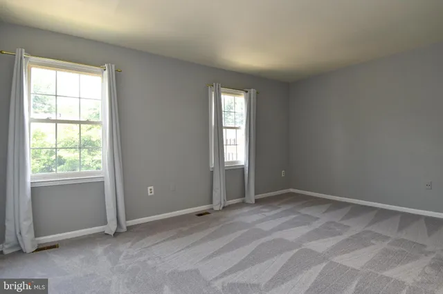 a view of an empty room with window