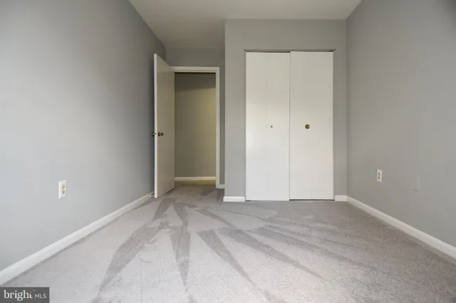 a bathroom with a sink and mirror with toilet